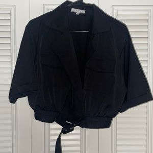 Black open chest top with a belt